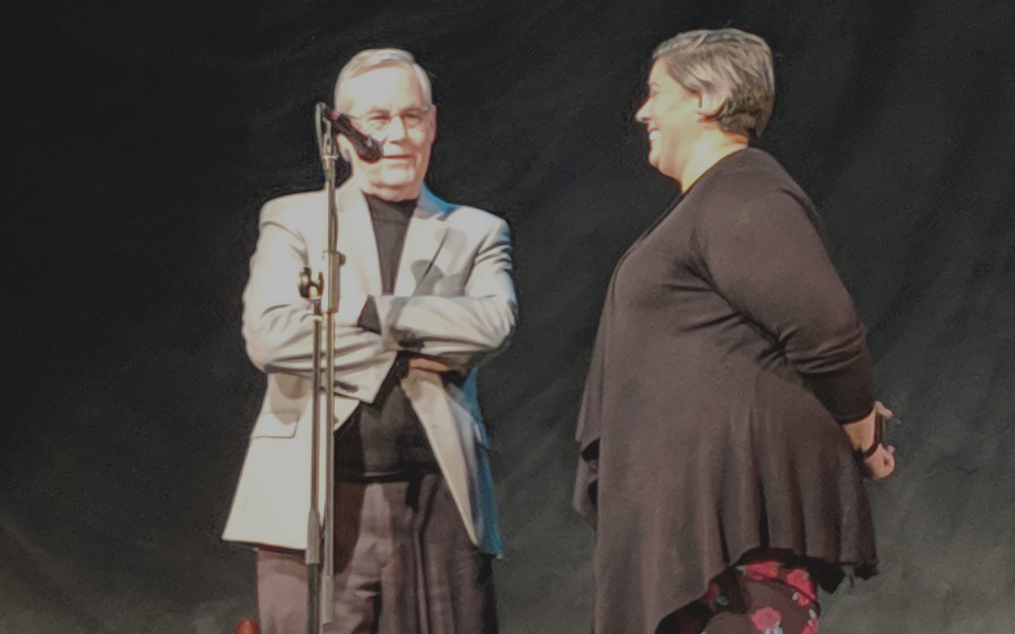 Deacon Rick Birkel and HTP Program Manager Jennifer Lucena speak at a 7 Deadly Sins performance about Kenton Women's Village
