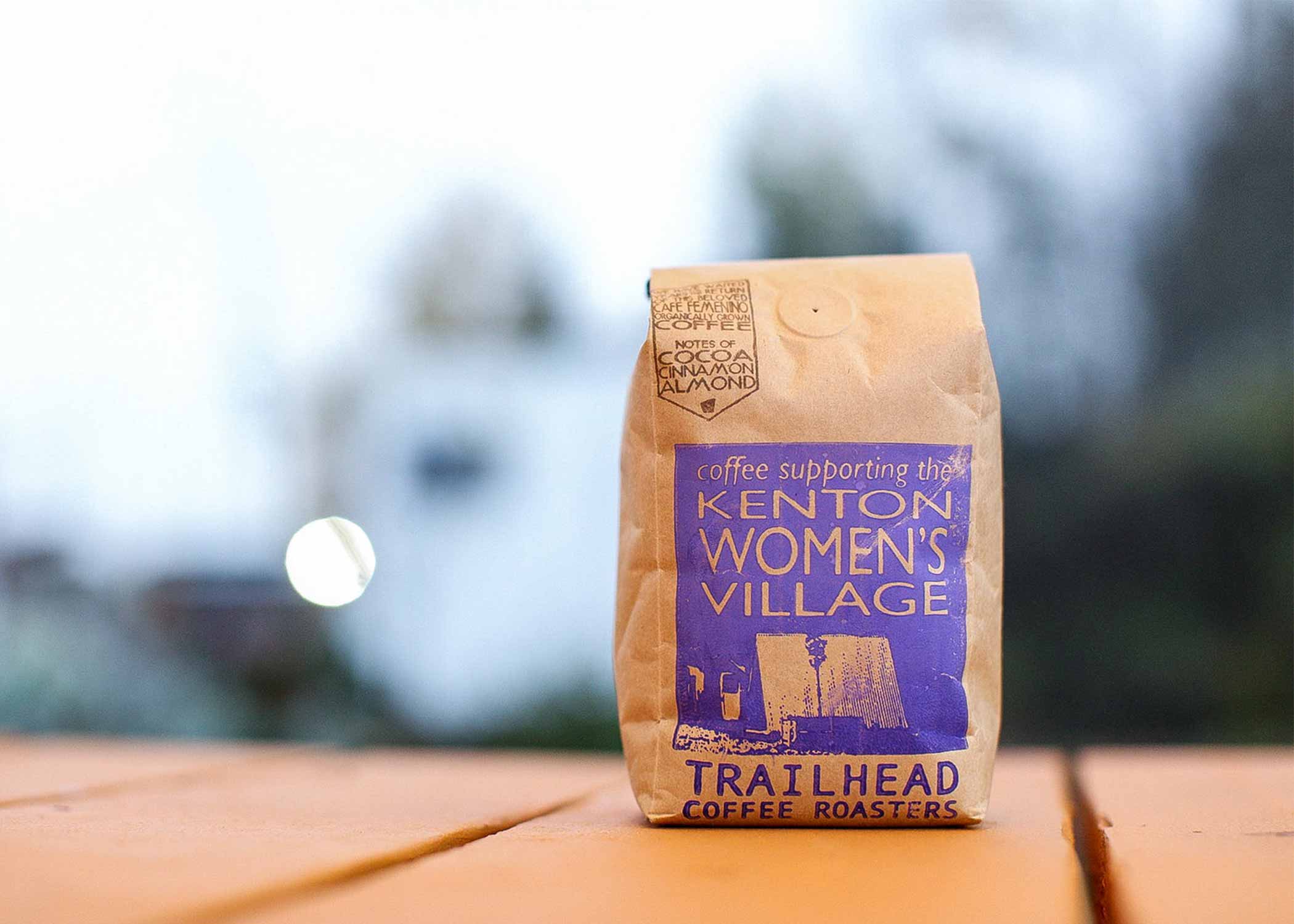 A bag of coffee promoting Kenton Women's Village on the label