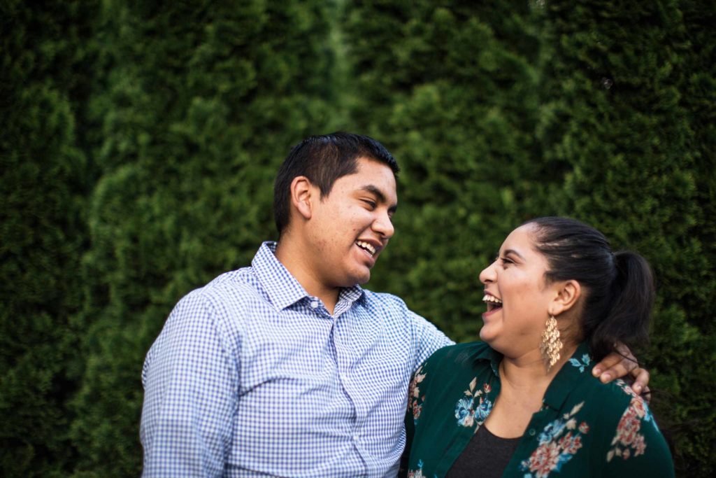 Man and woman smiling at each other.