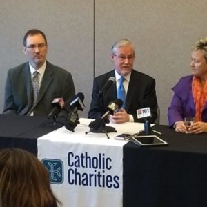 Deacon Rick Birkel at a press conference