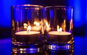 Two lit tealight candles
