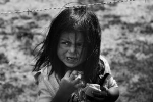 A child behind barbed wire