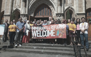 Catholic Charities takes part in a demonstration supporting Oregon's refugee resettlement agencies